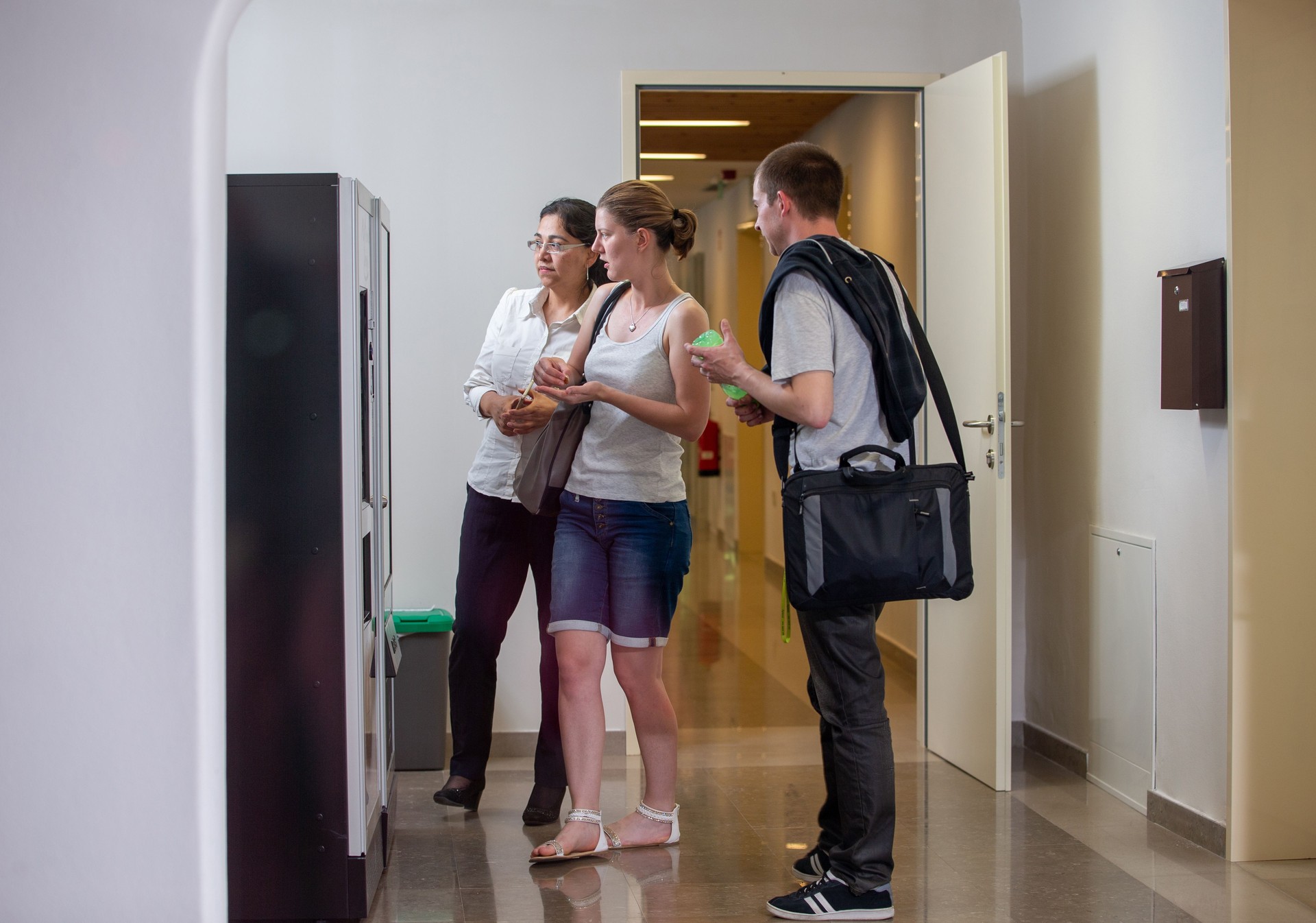 Students in School Taking Break for a Snack from Vending Machine